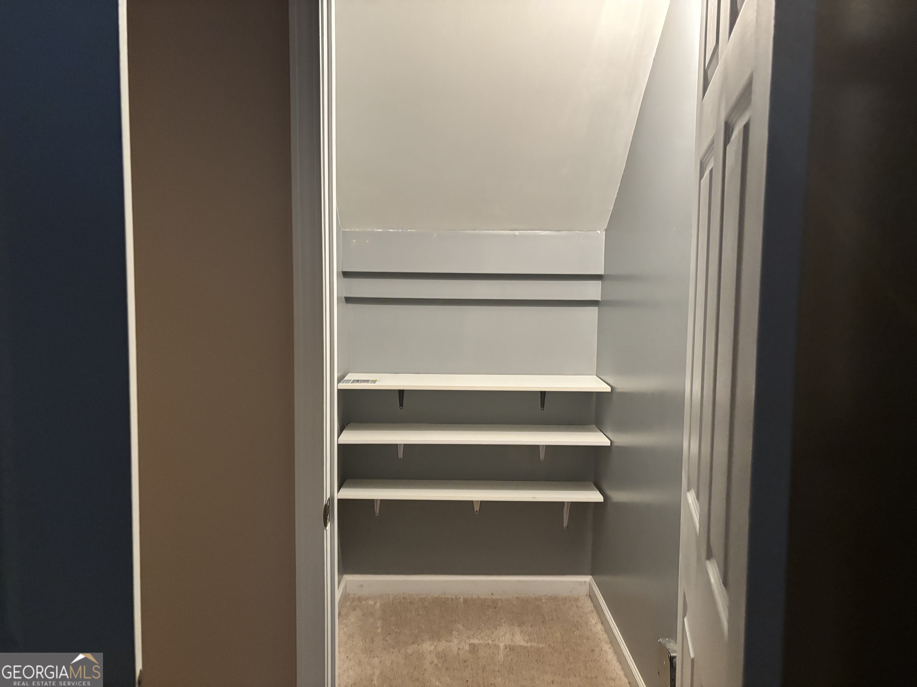 63 Highlander Trail Southwest Rome, GA 30165 - Photo 49 of 49 a view of walk in closet with empty racks