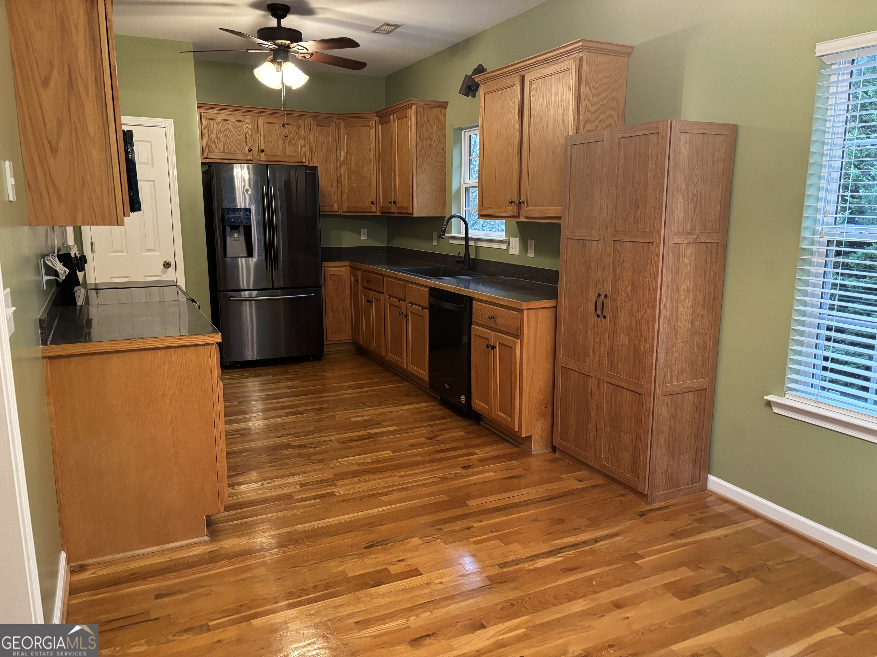 63 Highlander Trail Southwest Rome, GA 30165 - Photo 10 of 49 a kitchen with stainless steel appliances a refrigerator and a sink