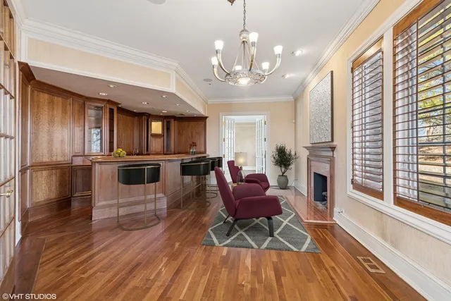 a large kitchen with kitchen island granite countertop a large window and a counter space