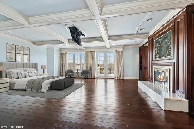 a kitchen with a sink and chairs