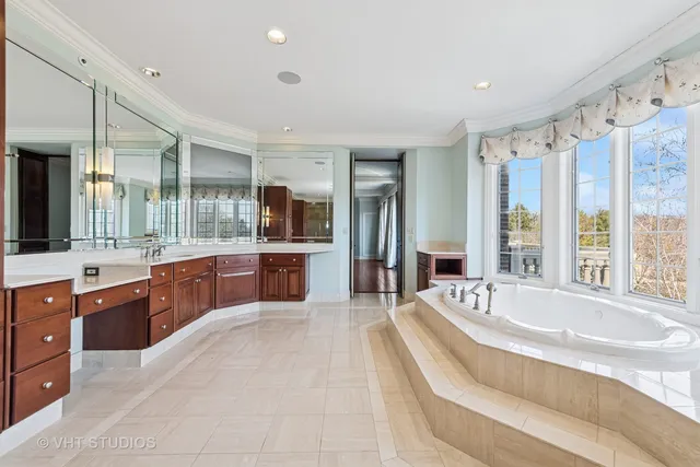 a bathroom with a sink mirror and a shower