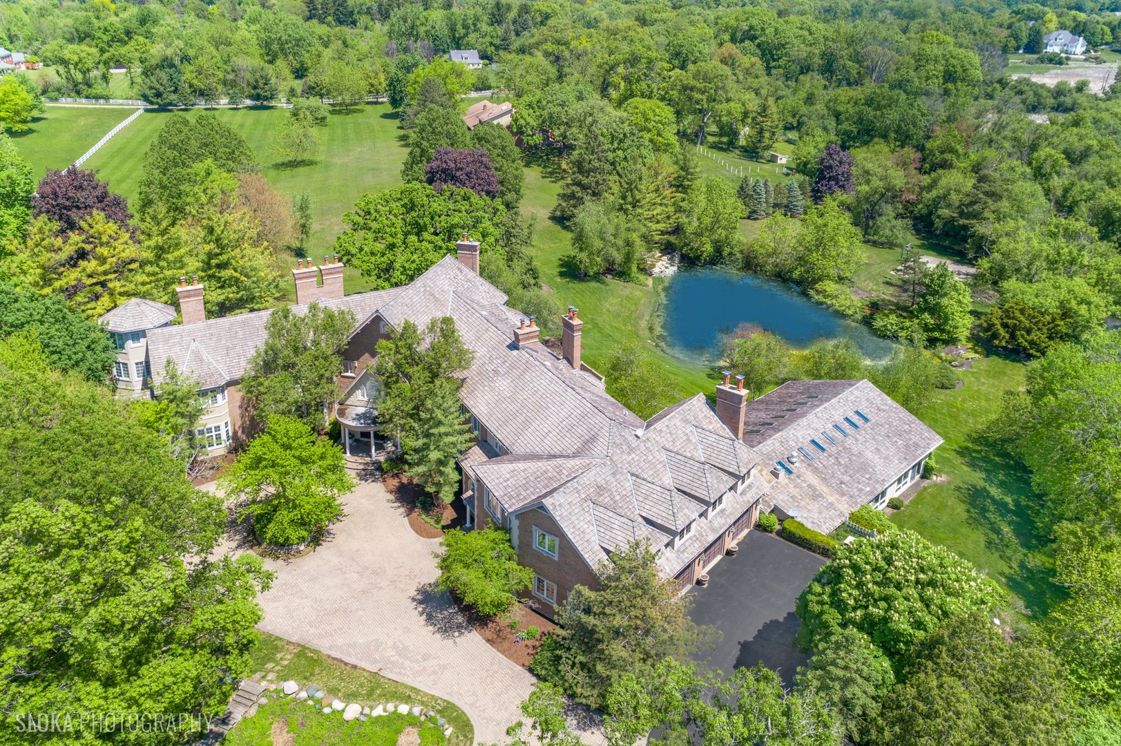 560 Oak Knoll Road Barrington Hills, IL 60010 - Photo 4 of 69 an aerial view of a house with outdoor space and lake view