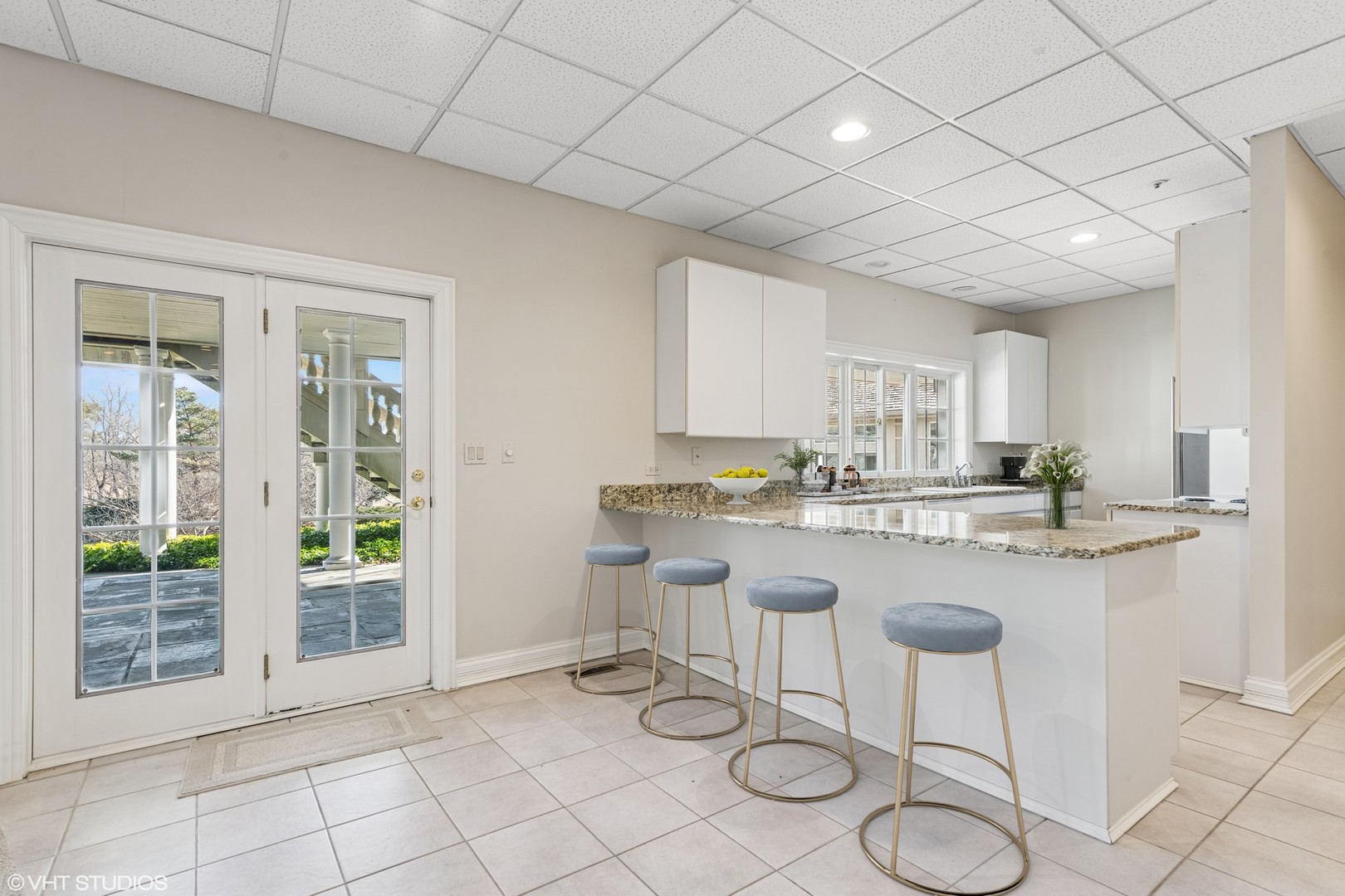 560 Oak Knoll Road Barrington Hills, IL 60010 - Photo 47 of 69 a kitchen with a sink and chairs