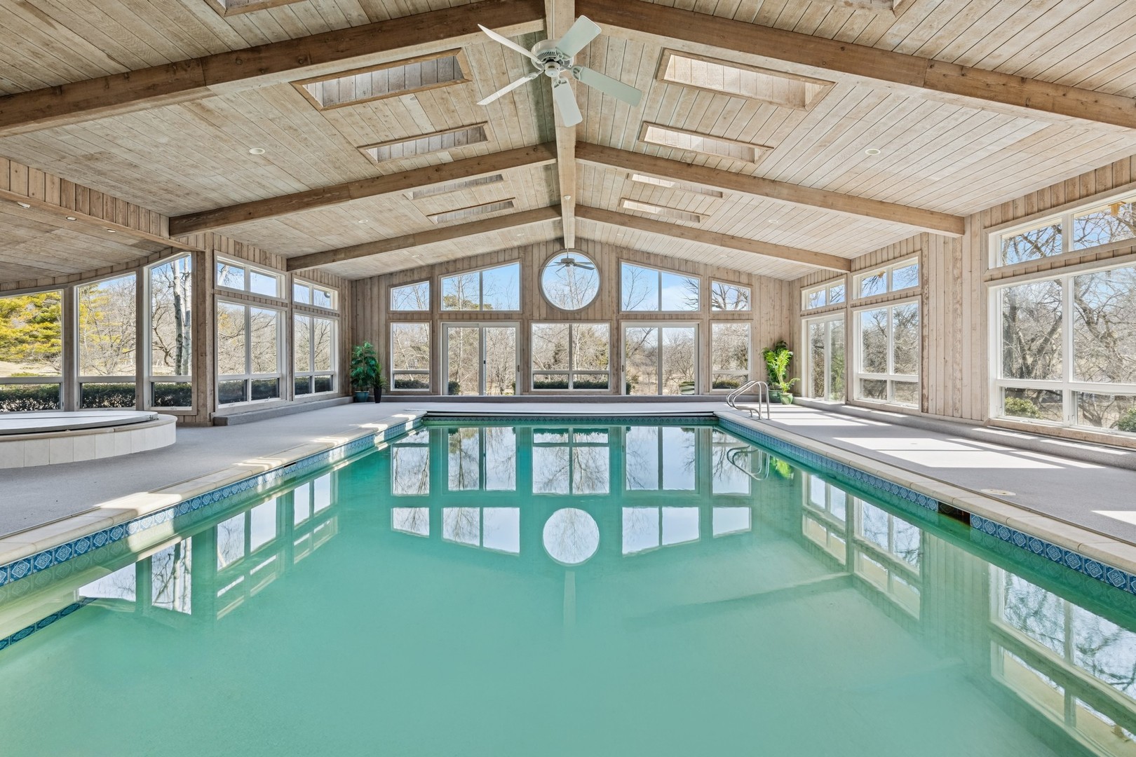 560 Oak Knoll Road Barrington Hills, IL 60010 - Photo 49 of 69 a large white kitchen with a large window and stainless steel appliances