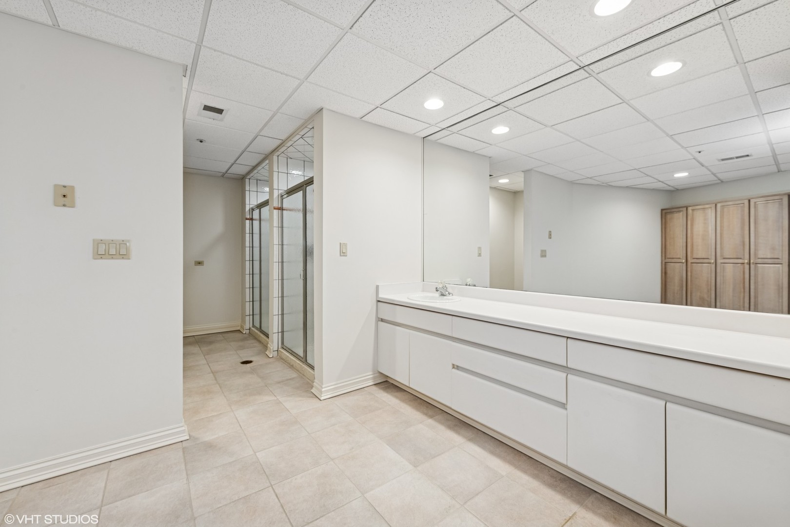 560 Oak Knoll Road Barrington Hills, IL 60010 - Photo 57 of 69 a bathroom with a sink mirror and a shower