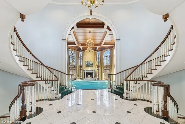 a view of a kitchen with stainless steel appliances granite countertop a sink and cabinets