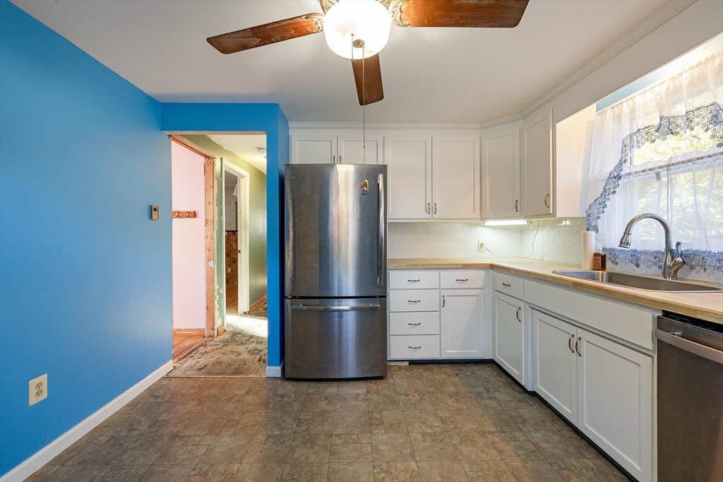 3 Henry Street Chicopee, MA 01020 - Photo 14 of 31 a kitchen with stainless steel appliances granite countertop a refrigerator and a sink