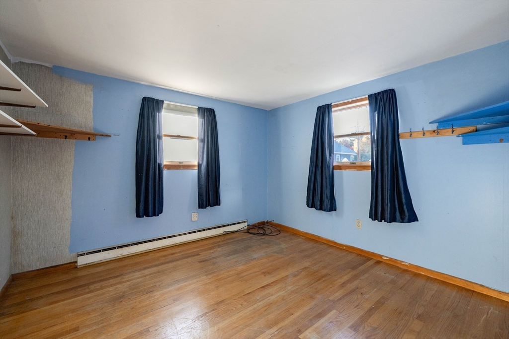 3 Henry Street Chicopee, MA 01020 - Photo 17 of 31 a view of an empty room with window and wooden floor