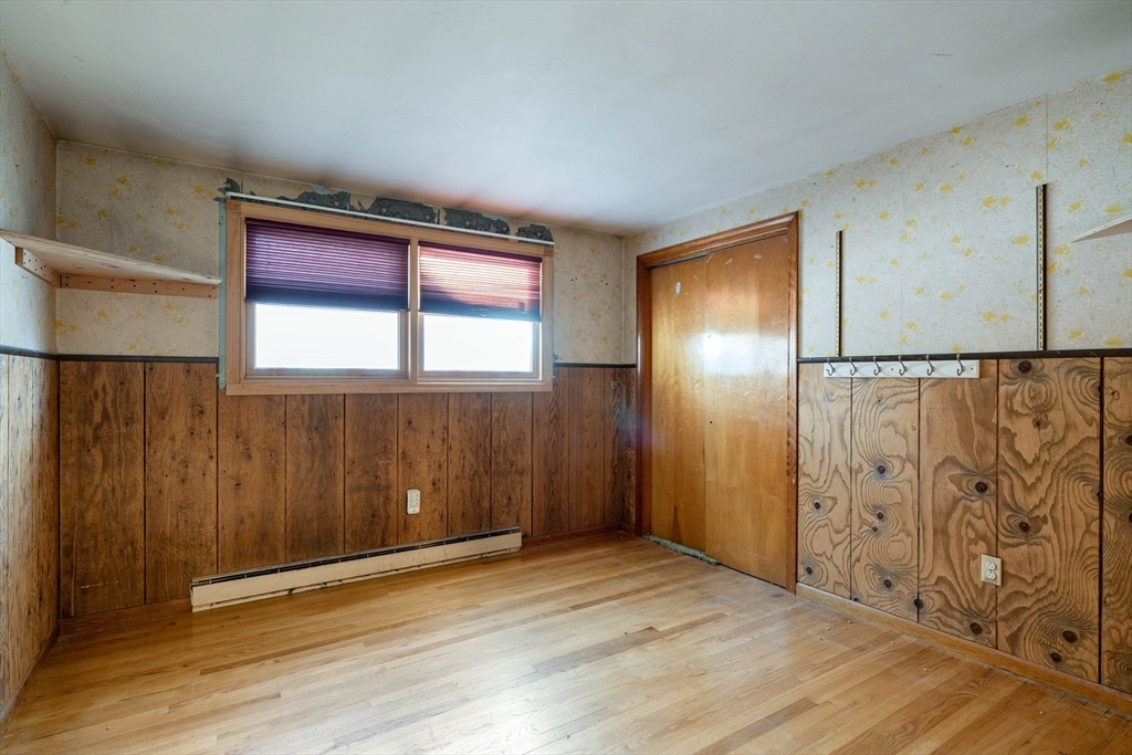 3 Henry Street Chicopee, MA 01020 - Photo 21 of 31 a view of an empty room with wooden floor and a window