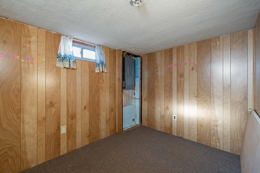 3 Henry Street Chicopee, MA 01020 - Photo 25 of 31 a view of empty room with wooden walls