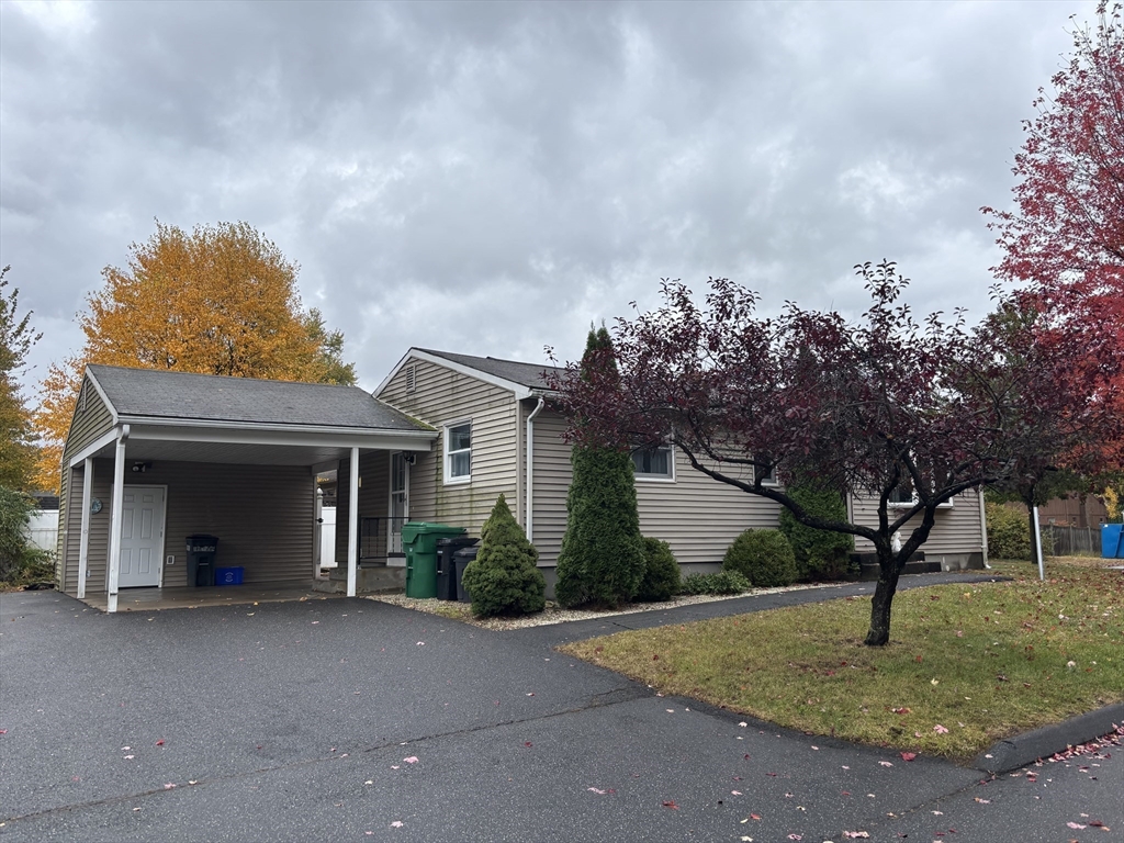 3 Henry Street Chicopee, MA 01020 - Photo 3 of 31 a view of a house with a yard and garage