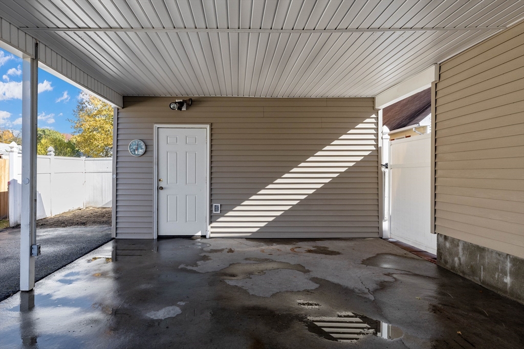 3 Henry Street Chicopee, MA 01020 - Photo 5 of 31 a view of a porch with wooden walls