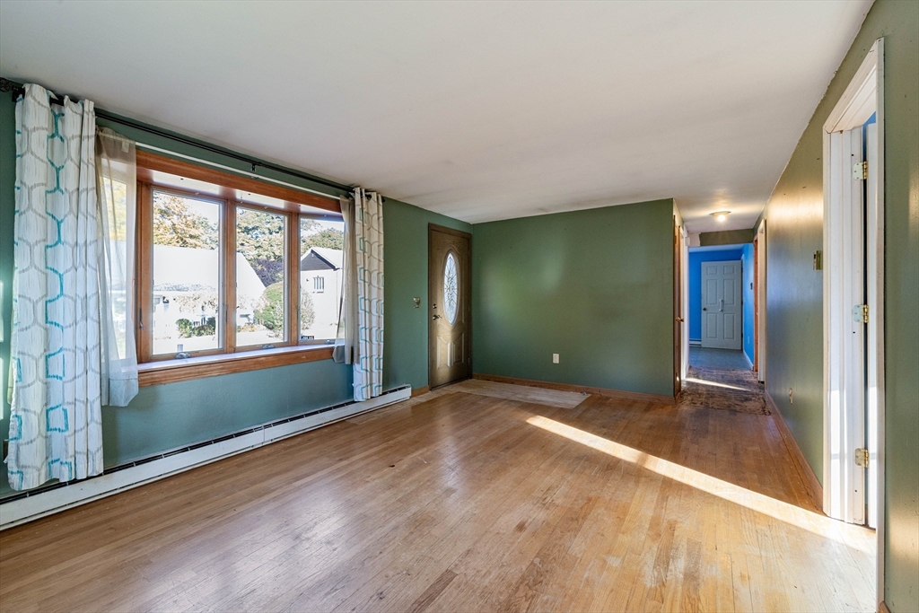 3 Henry Street Chicopee, MA 01020 - Photo 8 of 31 a view of empty room with window and wooden floor