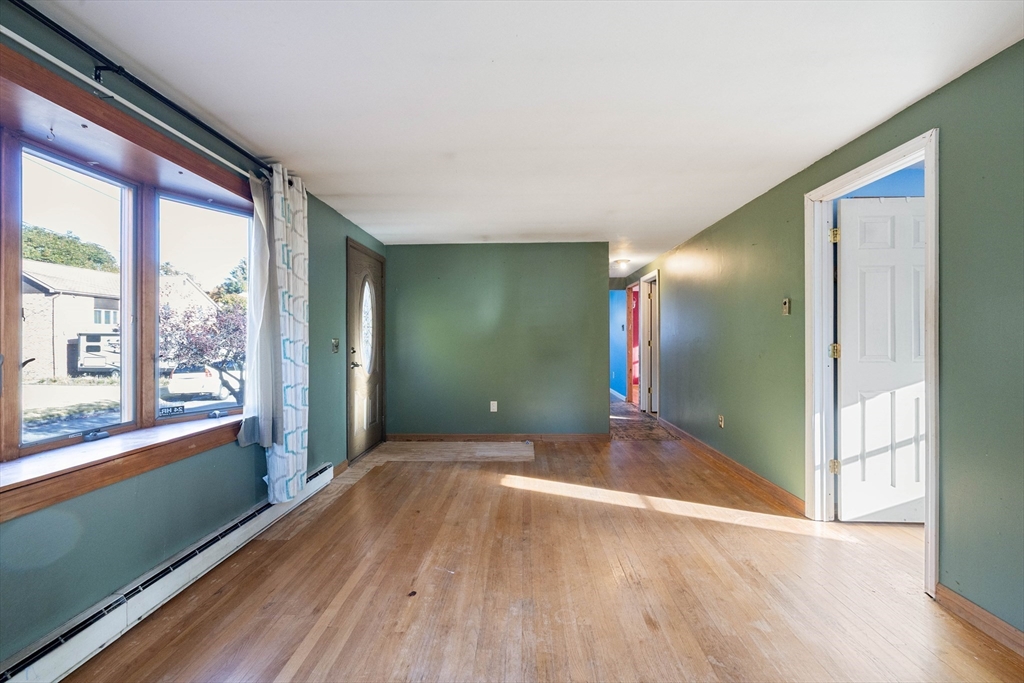 3 Henry Street Chicopee, MA 01020 - Photo 9 of 31 a view of empty room with wooden floor and fan