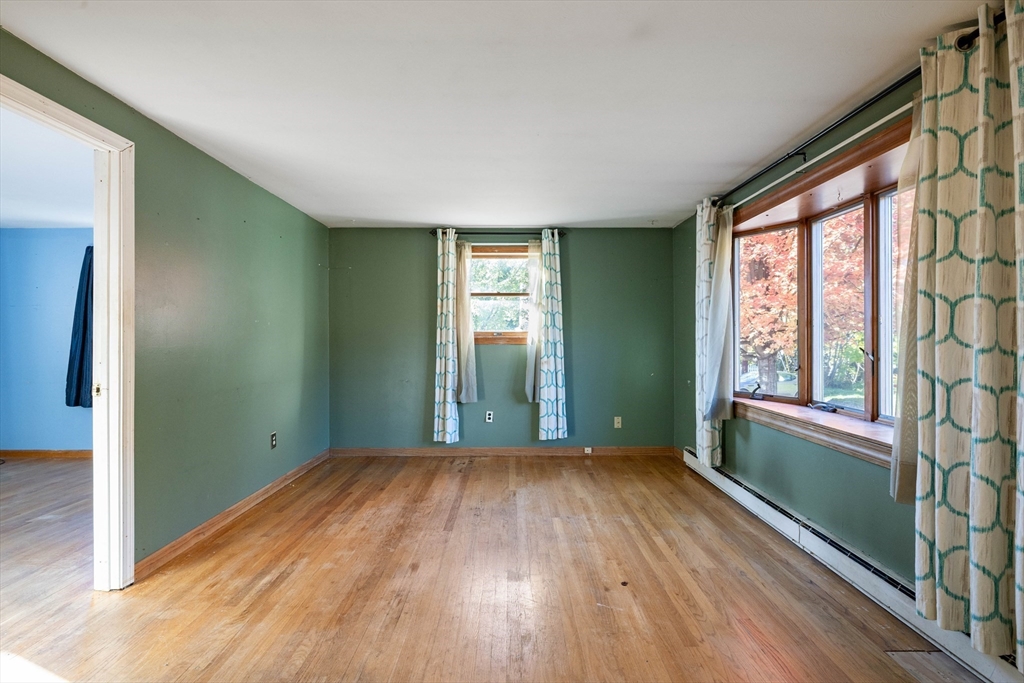 3 Henry Street Chicopee, MA 01020 - Photo 10 of 31 an empty room with wooden floor and windows