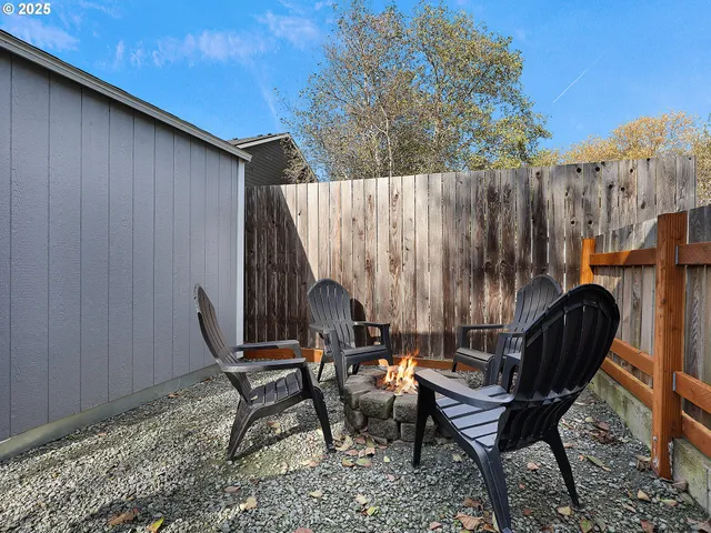 a backyard of a house with outdoor seating