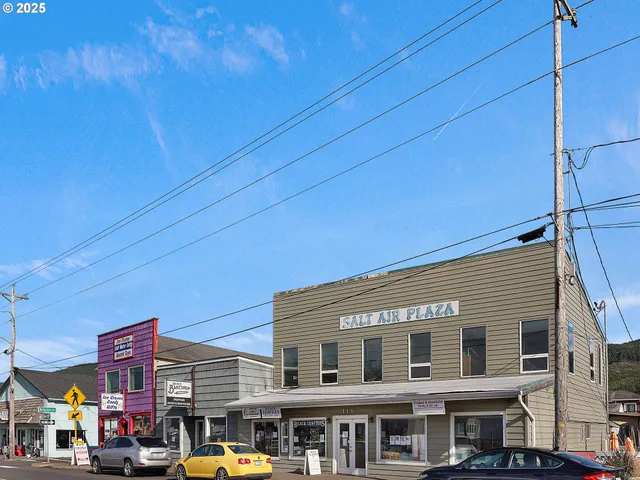 a front view of building with parking space