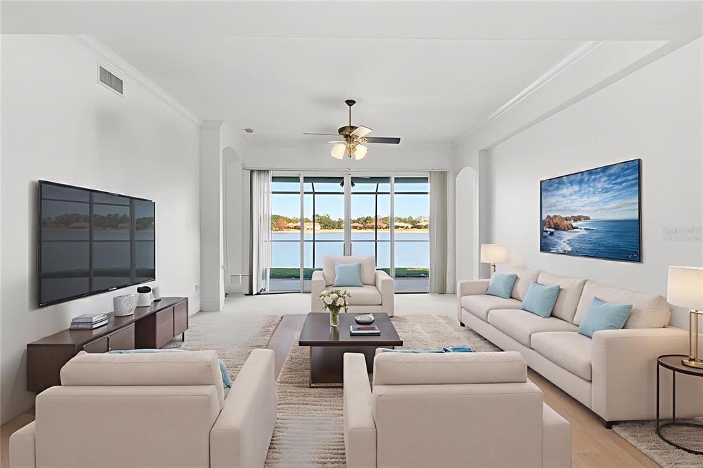 6515 Moorings Point Circle, Unit 102 Lakewood Ranch, FL 34202 - Photo 12 of 52 a living room with furniture and a flat screen tv