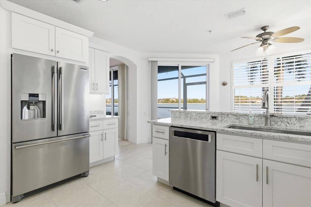 6515 Moorings Point Circle, Unit 102 Lakewood Ranch, FL 34202 - Photo 15 of 61 a kitchen with a sink stove and refrigerator