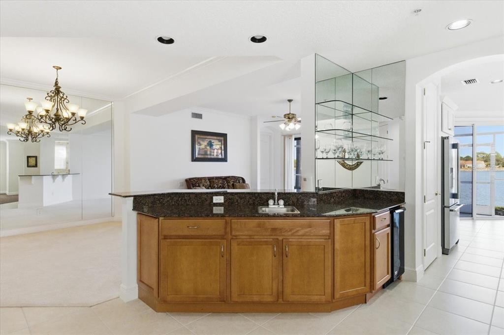 6515 Moorings Point Circle, Unit 102 Lakewood Ranch, FL 34202 - Photo 22 of 61 a bath room with granite countertop double vanity
