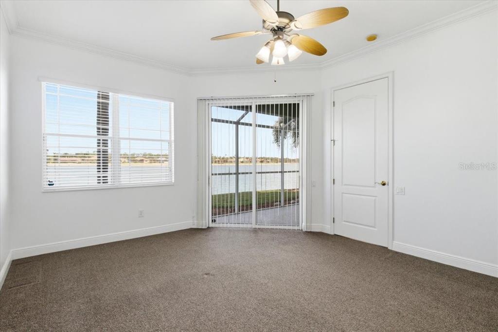 6515 Moorings Point Circle, Unit 102 Lakewood Ranch, FL 34202 - Photo 25 of 61 an empty room with windows and fan