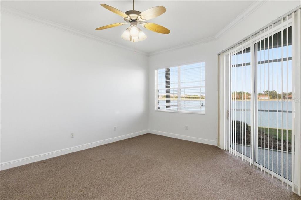 6515 Moorings Point Circle, Unit 102 Lakewood Ranch, FL 34202 - Photo 25 of 52 an empty room with windows and fan