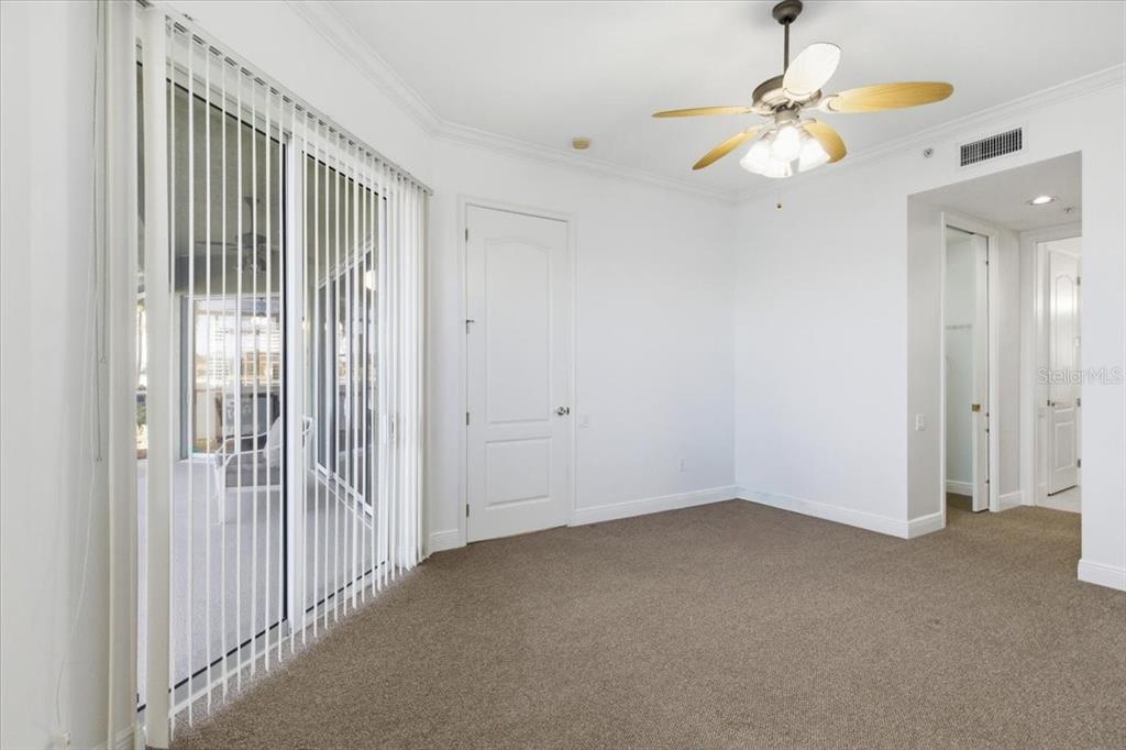 6515 Moorings Point Circle, Unit 102 Lakewood Ranch, FL 34202 - Photo 27 of 52 en empty room with chandelier fan
