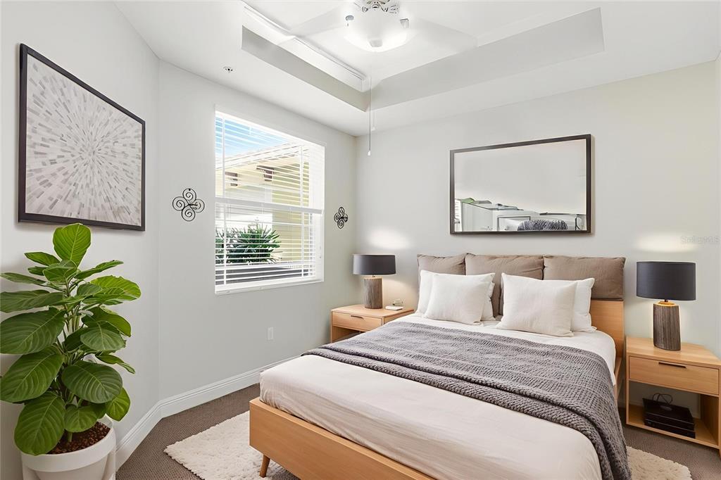 6515 Moorings Point Circle, Unit 102 Lakewood Ranch, FL 34202 - Photo 35 of 61 a bedroom with a bed and a potted plant