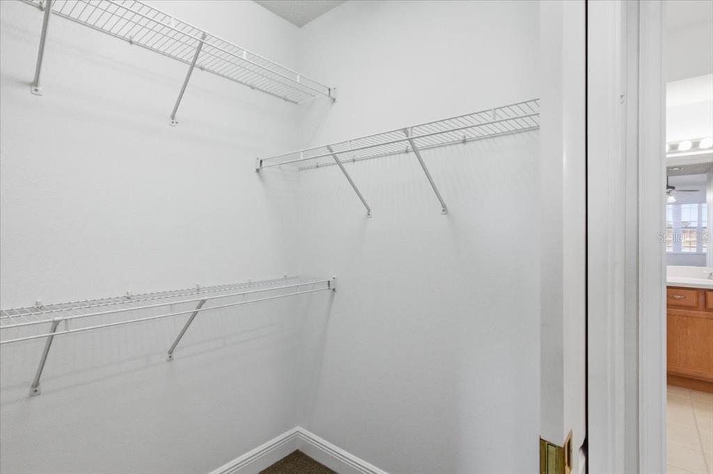 6515 Moorings Point Circle, Unit 102 Lakewood Ranch, FL 34202 - Photo 35 of 52 a view of a room with racks on the wall