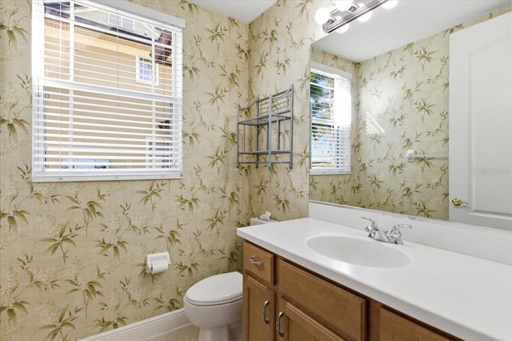6515 Moorings Point Circle, Unit 102 Lakewood Ranch, FL 34202 - Photo 40 of 61 a bathroom with a sink and a toilet