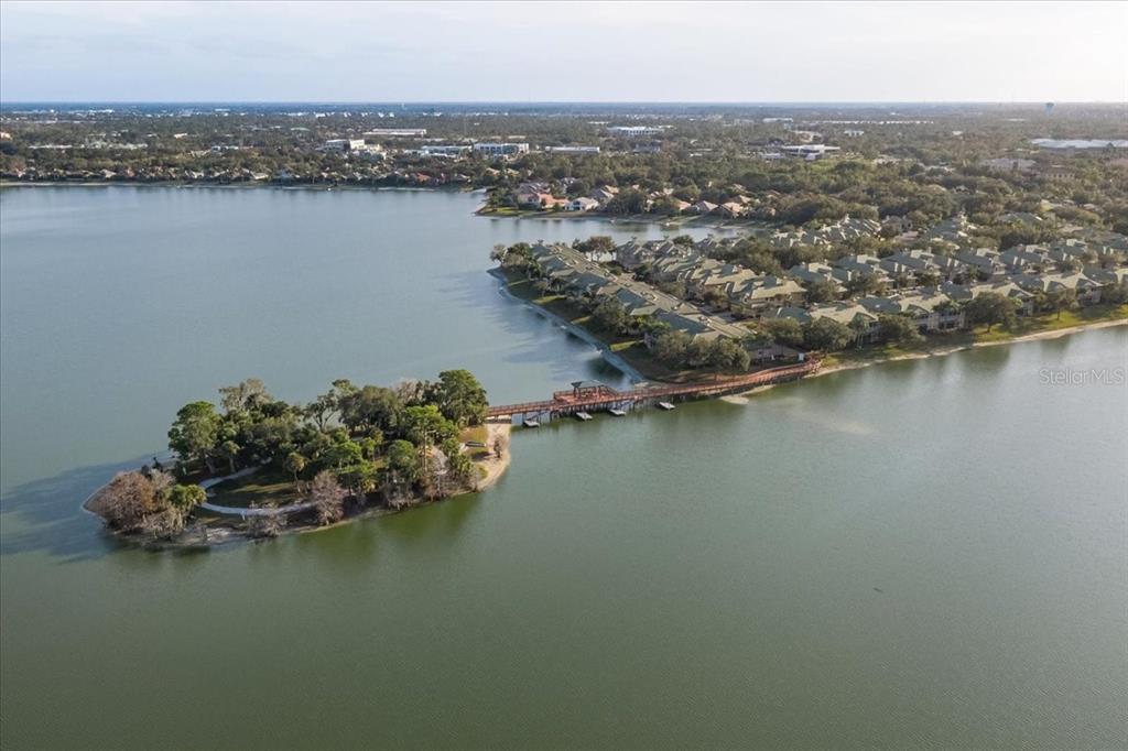 6515 Moorings Point Circle, Unit 102 Lakewood Ranch, FL 34202 - Photo 4 of 52 an aerial view of a city with lake view