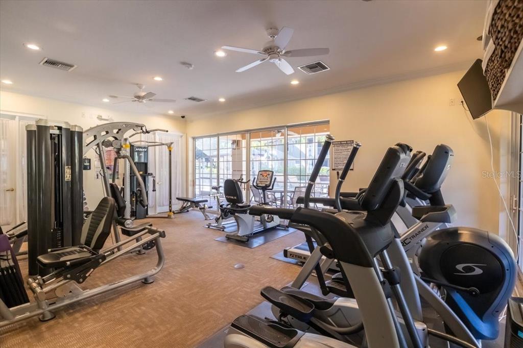 6515 Moorings Point Circle, Unit 102 Lakewood Ranch, FL 34202 - Photo 50 of 61 a view of a room with gym equipment