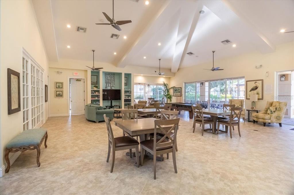 6515 Moorings Point Circle, Unit 102 Lakewood Ranch, FL 34202 - Photo 53 of 61 a view of a dining area with furniture