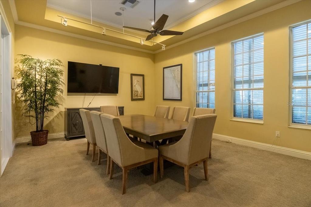 6515 Moorings Point Circle, Unit 102 Lakewood Ranch, FL 34202 - Photo 56 of 61 a dining room with furniture and window