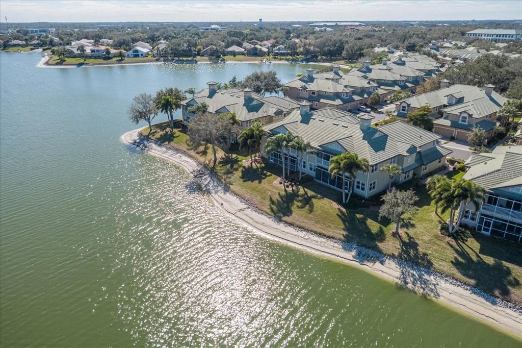 6515 Moorings Point Circle, Unit 102 Lakewood Ranch, FL 34202 - Photo 6 of 52 an aerial view of a house with a lake view
