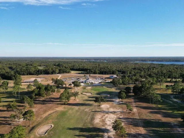 an aerial view of a house with a lake view