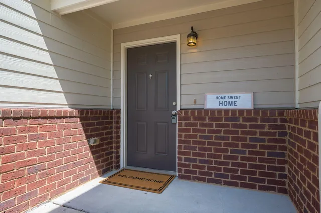 a view of an empty room and wooden floor