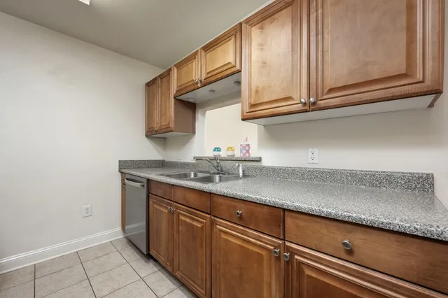 a kitchen with stainless steel appliances granite countertop a sink and cabinets
