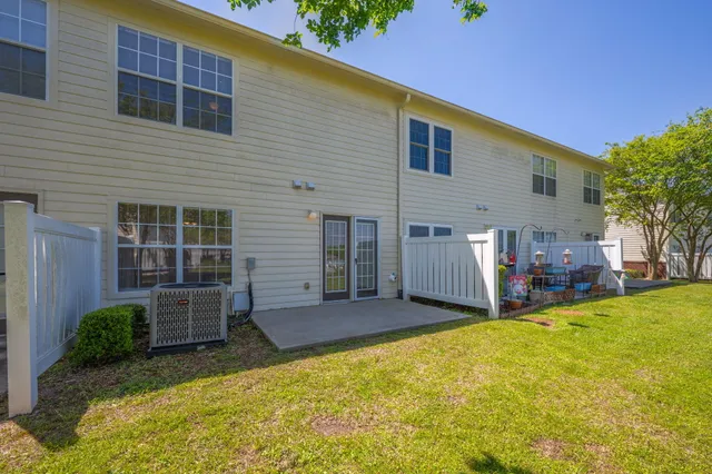 a swimming pool with trees in front of it