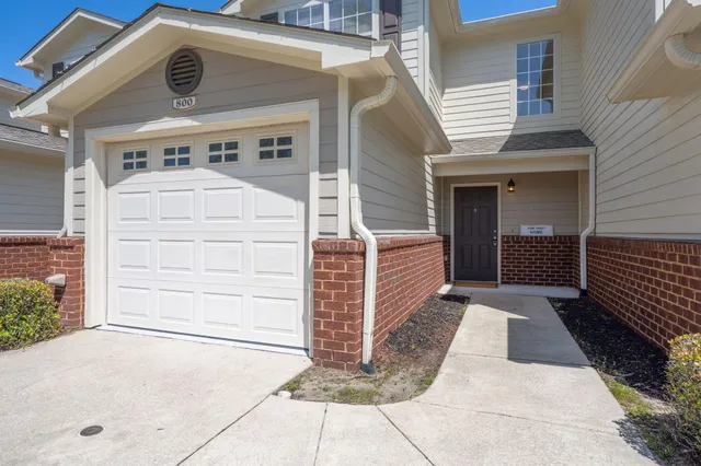 a front view of a house with a garage