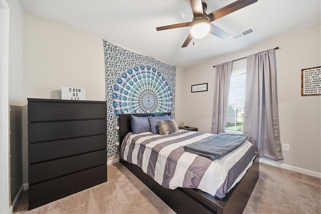 208 Grassy Creek Way Pendleton, SC 29670 - Photo 33 of 43 Comfortable bedroom with carpeted flooring and an overhead ceiling fan for optimal airflow.