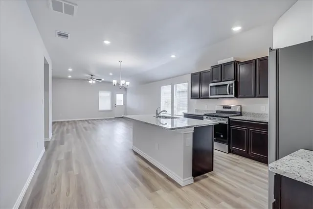 a bathroom with a granite countertop sink mirror and double