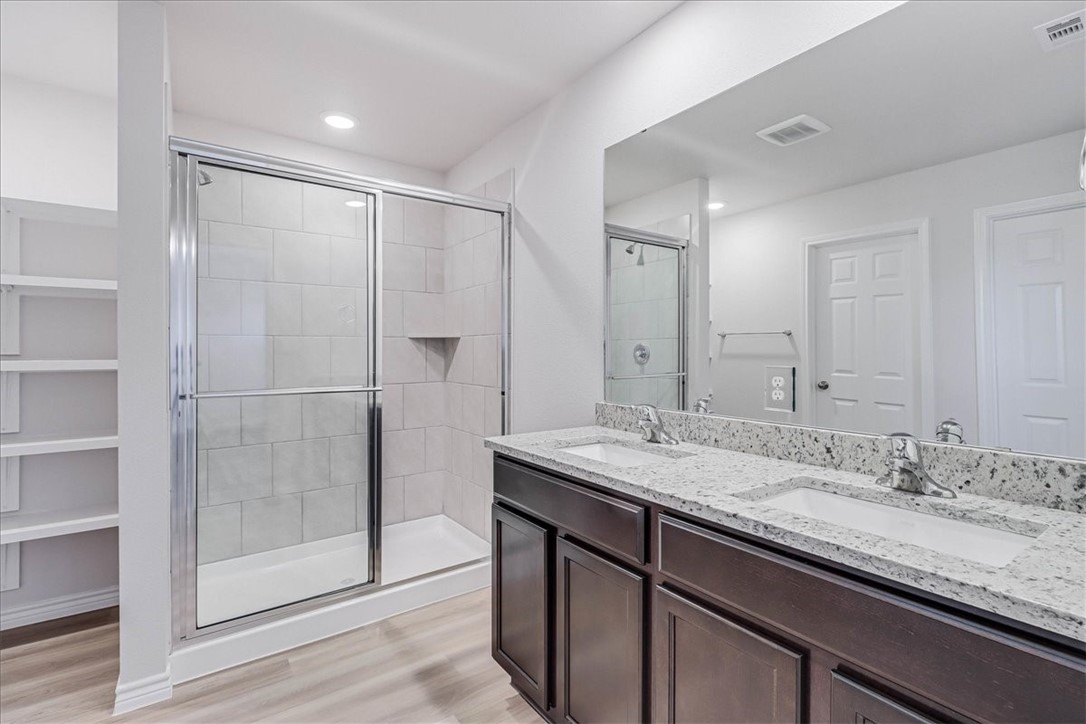1634 Comfy Way Corpus Christi, TX 78418 - Photo 20 of 39 a bathroom with a granite countertop sink mirror and double