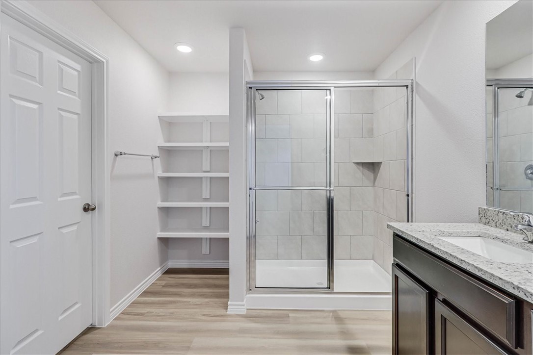 1634 Comfy Way Corpus Christi, TX 78418 - Photo 21 of 39 a bathroom with a shower and a sink