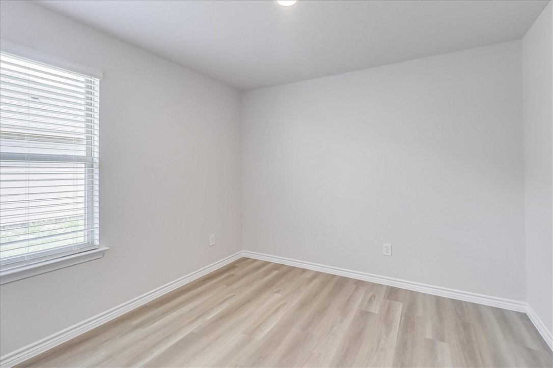 1634 Comfy Way Corpus Christi, TX 78418 - Photo 25 of 39 a view of an empty room and a window