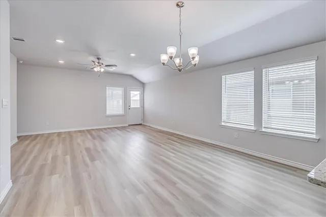 a kitchen with granite countertop stainless steel appliances cabinets a sink and a counter space