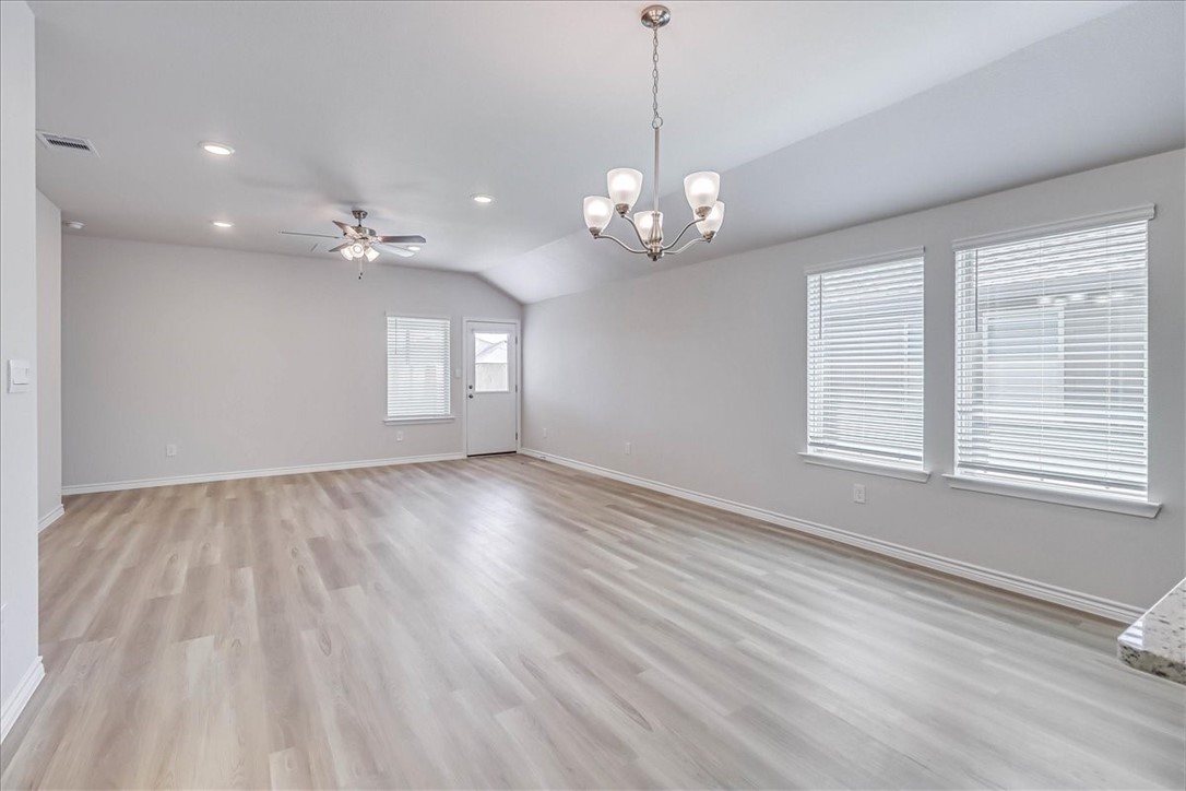 1634 Comfy Way Corpus Christi, TX 78418 - Photo 6 of 39 a view of empty room with wooden floor and window