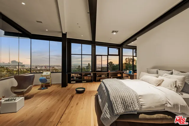 a white bath tub sitting in front of a window