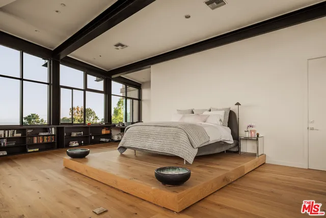 a bathroom with a sink a mirror and shower