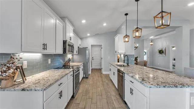 a view of living room with granite countertop furniture and fireplace